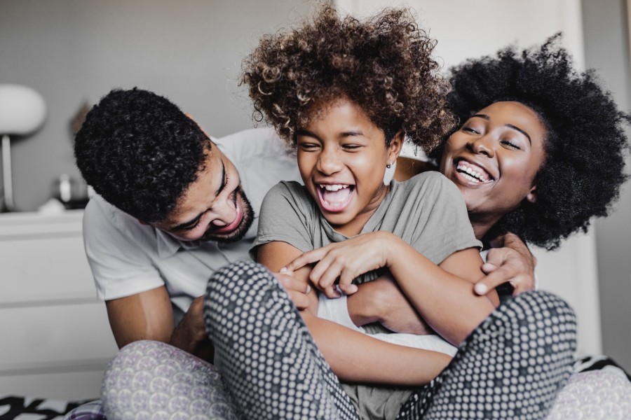 family embracing and laughing